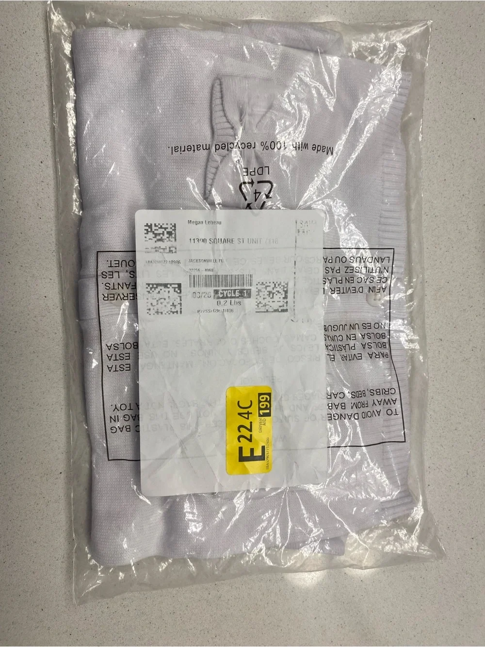 Men's white folded shirt in packaging